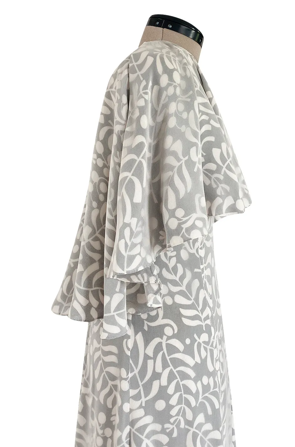 1970s James Galanos Soft Pale Grey & White Floral Print Silk & Silk Chiffon Caped Dress