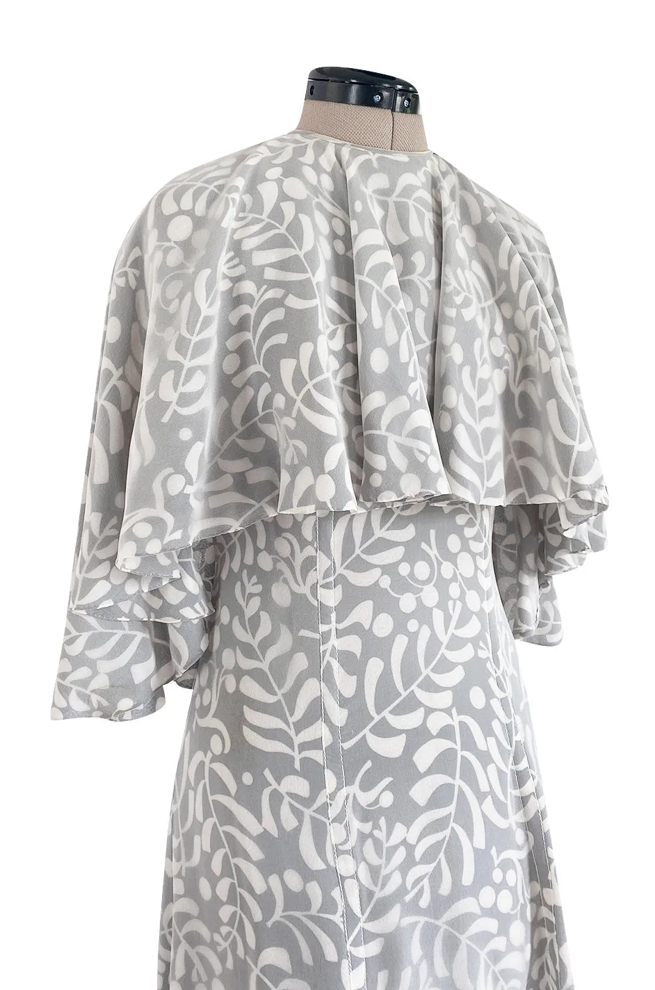 1970s James Galanos Soft Pale Grey & White Floral Print Silk & Silk Chiffon Caped Dress