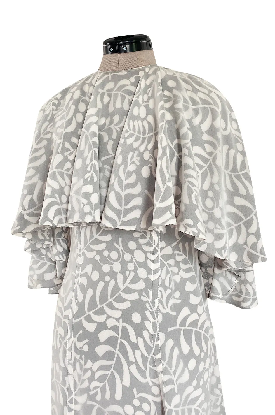 1970s James Galanos Soft Pale Grey & White Floral Print Silk & Silk Chiffon Caped Dress
