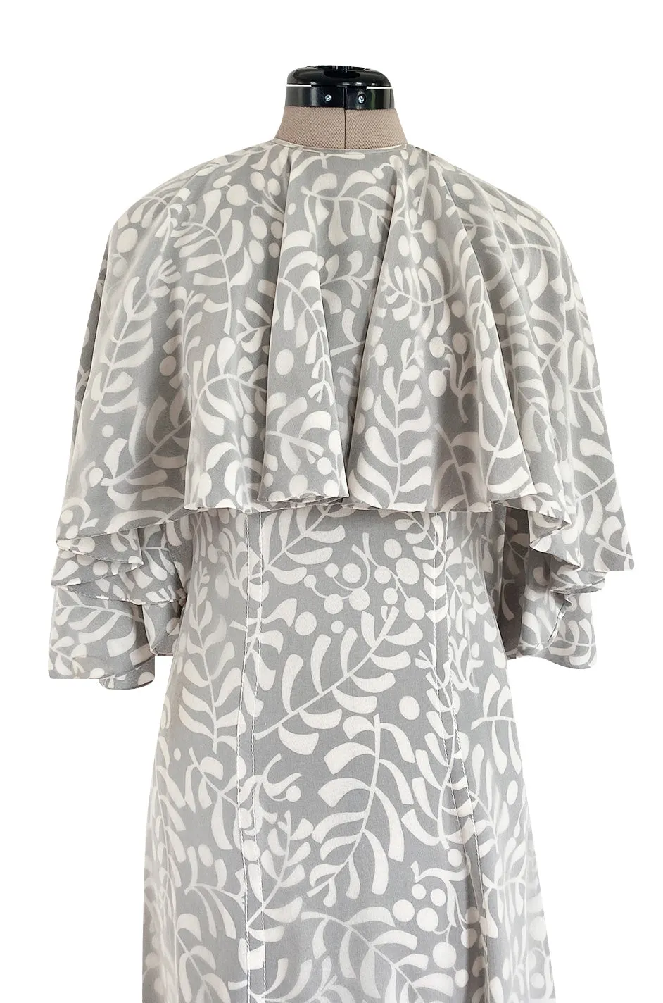1970s James Galanos Soft Pale Grey & White Floral Print Silk & Silk Chiffon Caped Dress