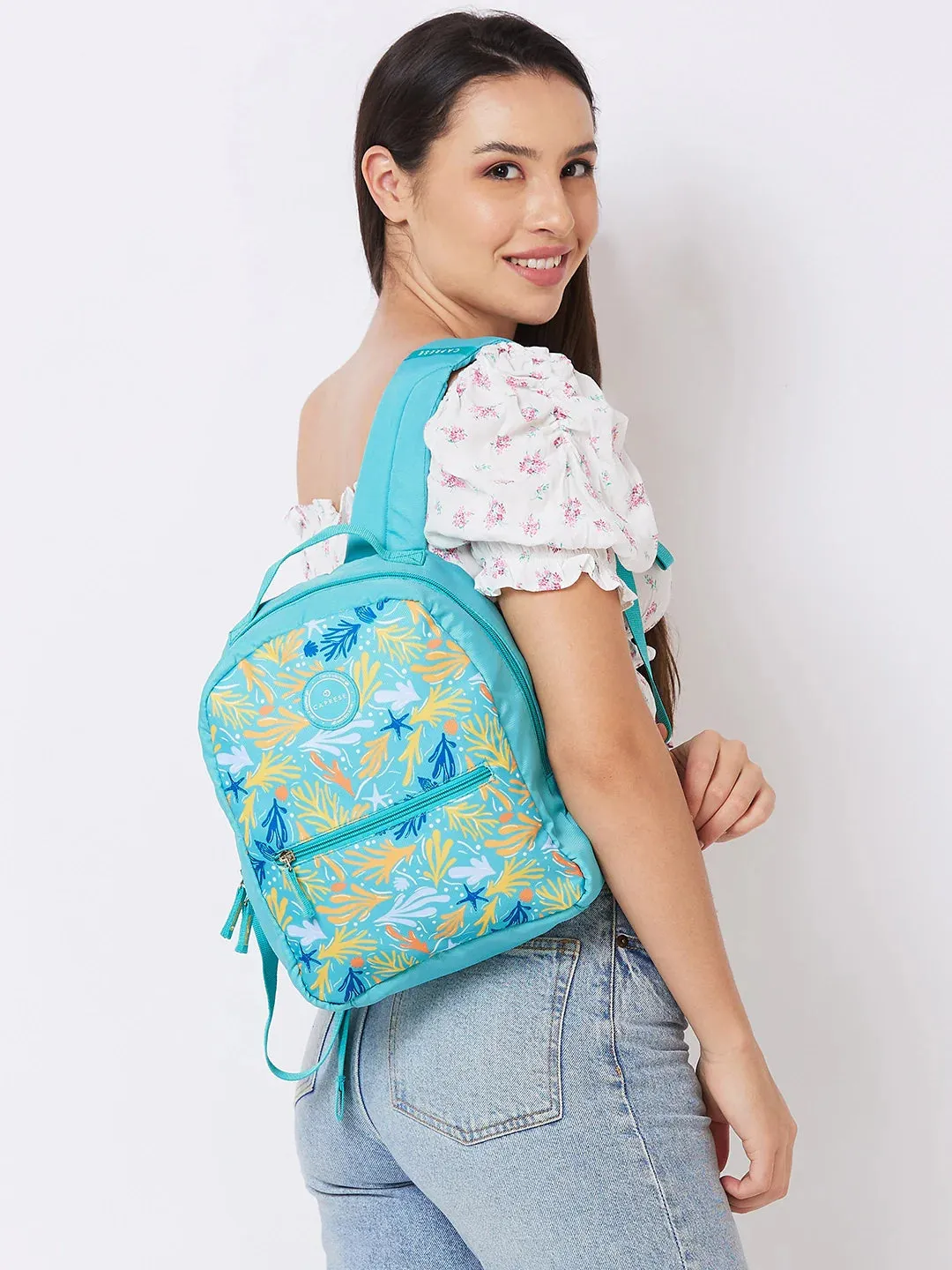 Caprese Xenia Small Turquoise Printed Backpack