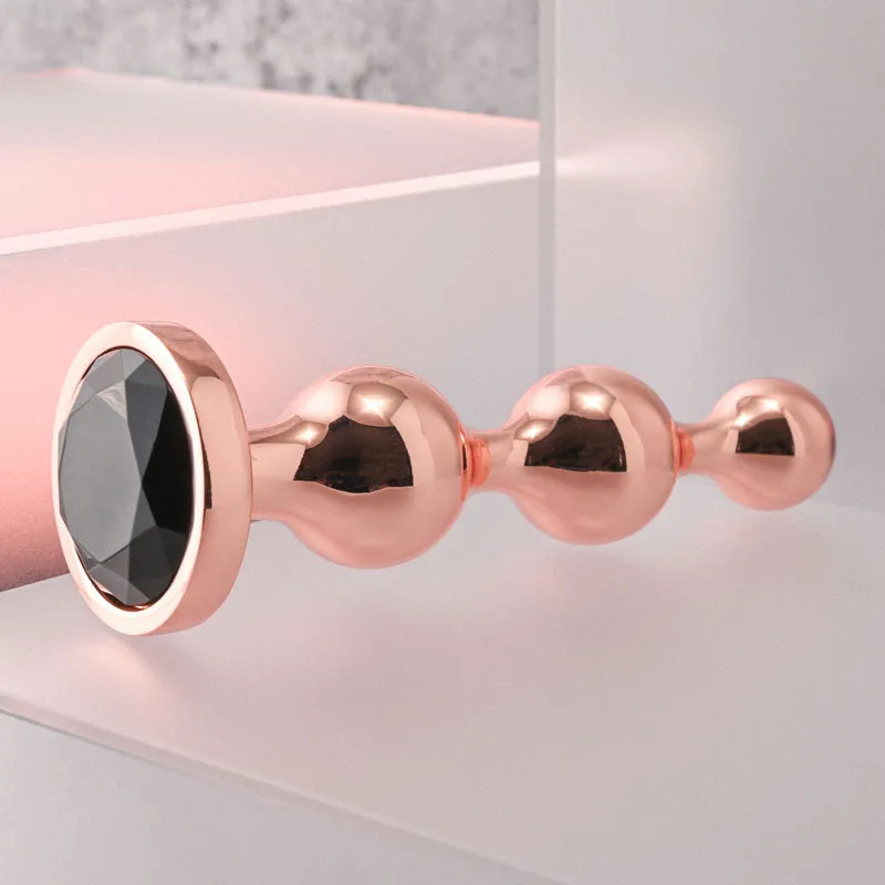 Gender X Gold Digger - Large Rose Gold Butt Plug with Black Gem Base